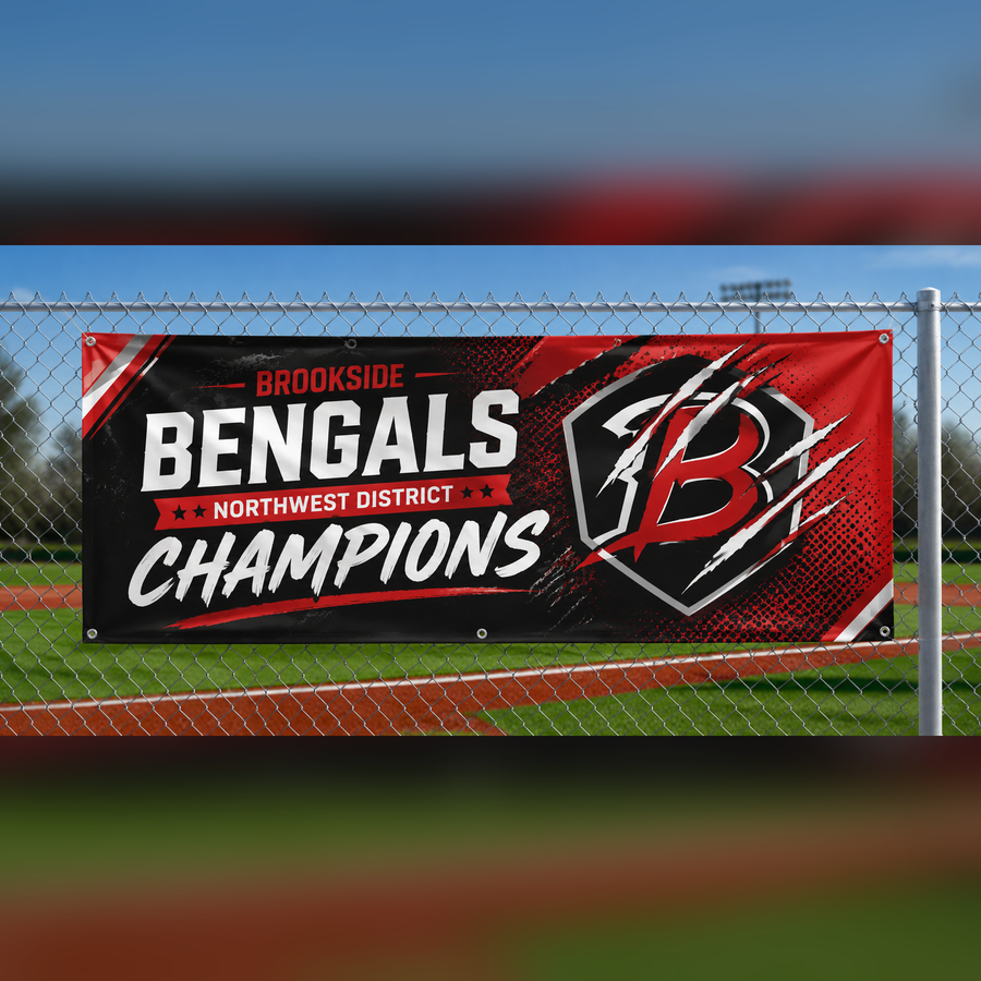 HD vinyl sports banner with grommets zip-tied to a ballfield fence